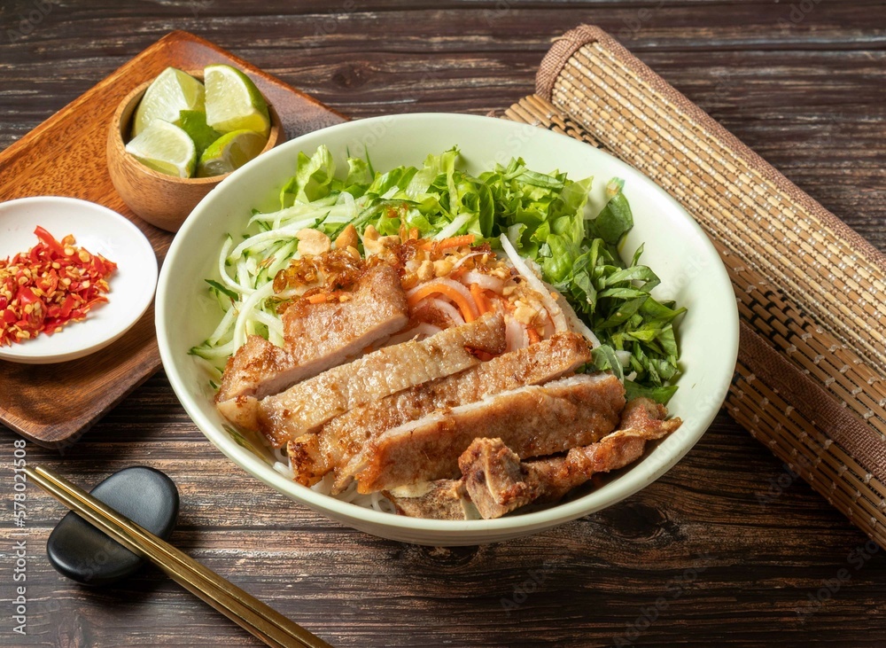 Pork Chops with Vietnamese Rice Noodles served in bowl isolated on table top view of taiwan food