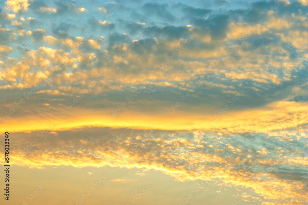 Clouds and evening golden sky, abstract background, copy space for text.