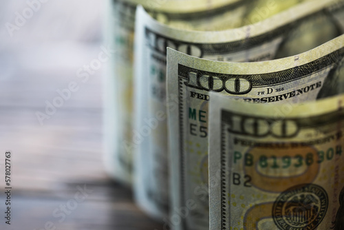 Money, US dollar bills background. Money scattered on the desk. Photography for Finance and Economy concepts. photo