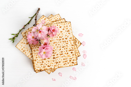 Matzo  with almond flowers. Pesach celebration concept (jewish Passover holiday)