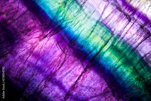 Fluorite layered slice. macro detail texture background. close-up polished semi-precious gemstone. photo