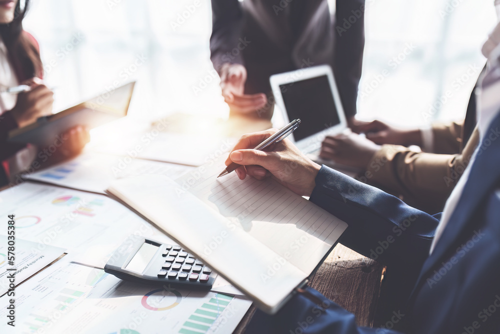 Business team working with financial document at office. analysis, discussion and brainstorming, business strategy Business team working with financial document at office. analysis, discussion and brainstorming, business strategy