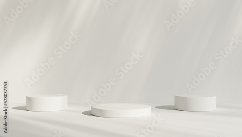 Abstract white room with realistic white cylinder pedestal podium set and leaf shadow overlay. Minimal scene for product display presentation. geometric platform stage for showcase.