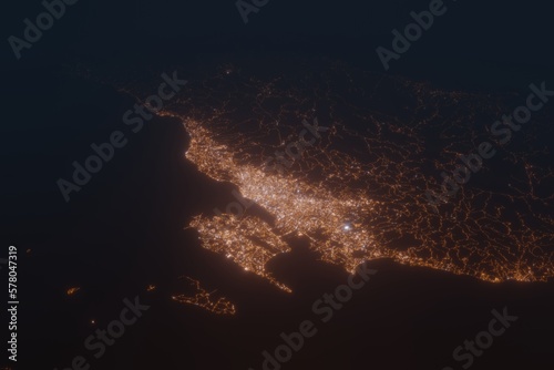 Aerial shot on Cebu (Philippines) at night, view from east. Imitation of satellite view on modern city with street lights and glow effect. 3d render