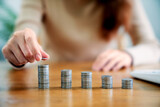 Woman with coin stack. Financial Growing savings concept. Saving money by hand putting coins money accounting planning.