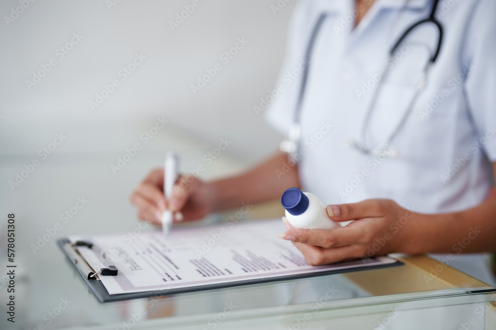 Fototapeta premium Asian woman pharmacist working at Pharmacy Drugstore . Medical healthcare concept