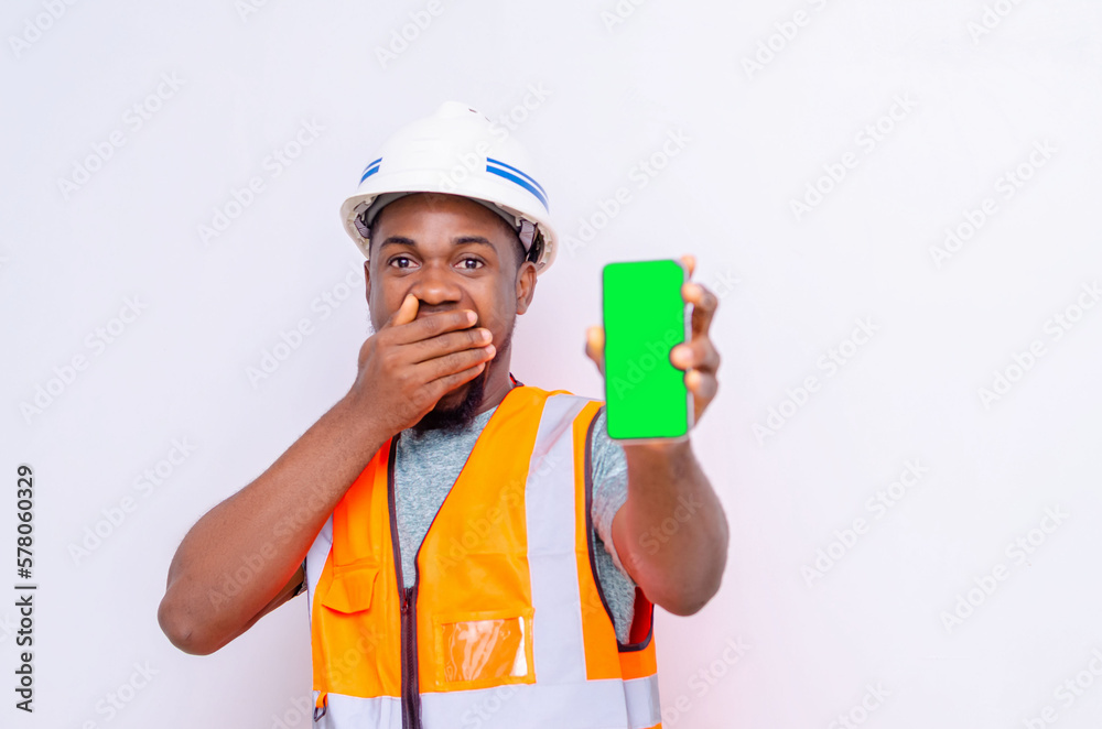 Architects holding a smartphone with isolated blank screen. Architects holding a smartphone with isolated blank screen.