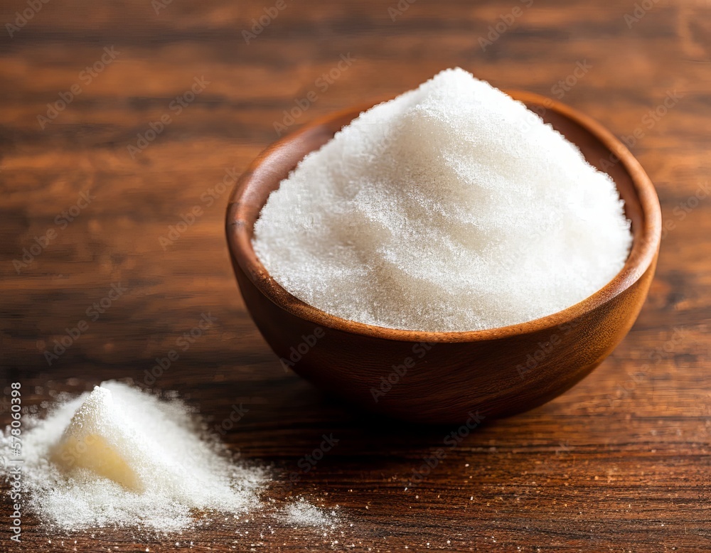 sea salt in a wooden spoon on a brown background sea salt in a wooden spoon on a brown background