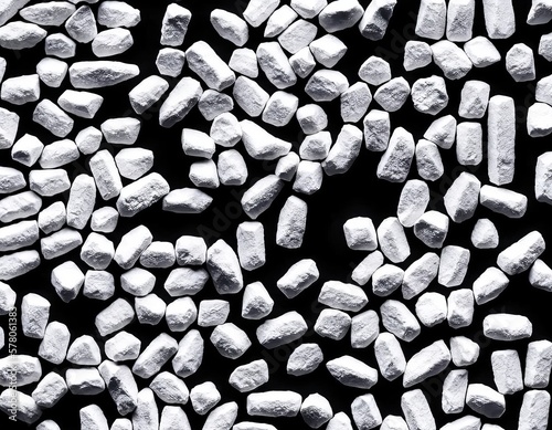 pile of crushed sugar on black background