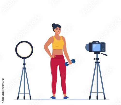 Woman dressed in sports clothes does exercises with dumbbells recording video with camera on tripod. Social network blogging, healthy lifestyle concept. Sport streming. Vector illustration.