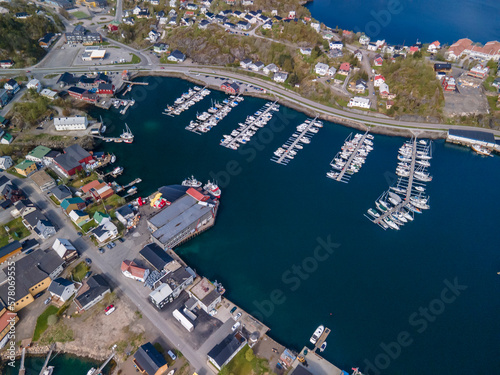 Aerial footage of Svolvaer in Lofoten, Norway, during a sunny spring day with few clouds and blue sky