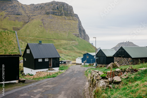 Village in the mountains. Beautiful view of the village of Gasadalur in the Faroe Islands (ID: 578070789)