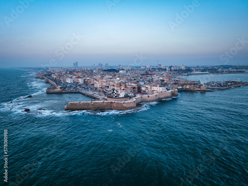 Acre (Akko) is a port city located on the Mediterranean coast and is known for its well-preserved ancient city fortifications. .Aerial footage of the old city, the ancient port and marina. © Epolifoto