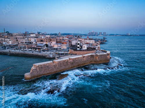 Acre (Akko) is a port city located on the Mediterranean coast and is known for its well-preserved ancient city fortifications. .Aerial footage of the old city, the ancient port and marina.