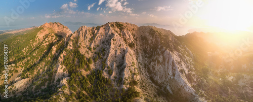 Kos island hiking: Mount Dikeos. Panoramatic, aerial view of two highest peaks of Island Kos, Dikeos and Christos, illuminated by setting sun, vibrant colors, overal view of Kos island, Greece.