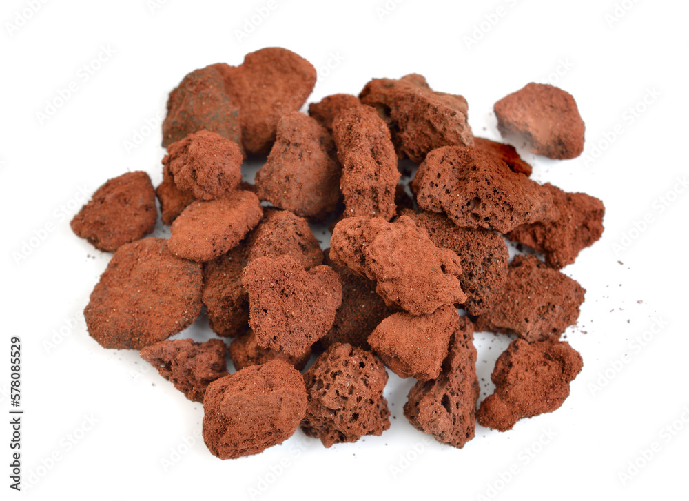 Porous brown volcanic rock isolated on white background. Lava stone, pumice stone Porous brown volcanic rock isolated on white background. Lava stone, pumice stone