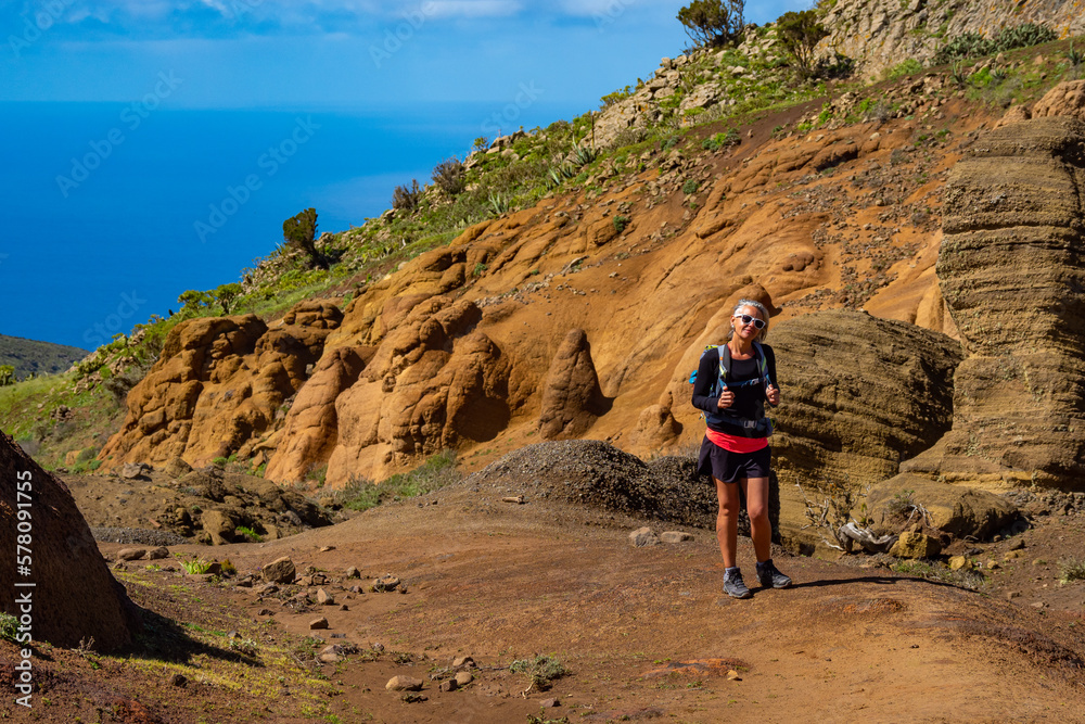 Female hiker hiking the mountains of Teno Alto in Tenerife Canary Islands