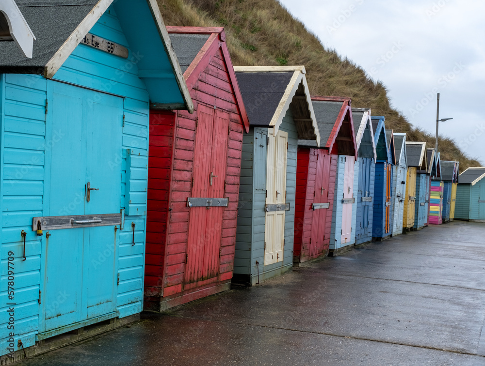 Colourful beach huts along the promenade in the seaside town of Sheringham on the North Norfolk coast Colourful beach huts along the promenade in the seaside town of Sheringham on the North Norfolk coast