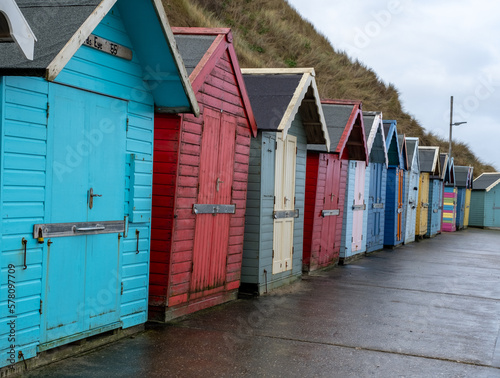 Colourful beach huts along the promenade in the seaside town of Sheringham on the North Norfolk coast © yackers1