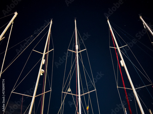 Masts of ship at night