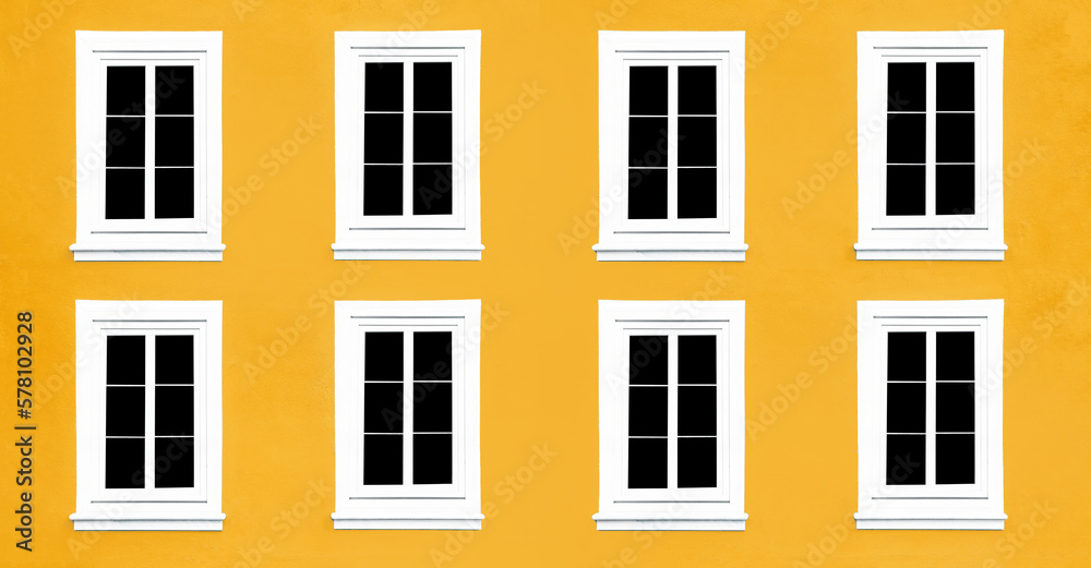 PVC Windows. Architecture background. Vibrant color yellow wall facade. Small town house exterior. Street of European city building. Eight window frames isolated on empty wall. Simple windows in a row