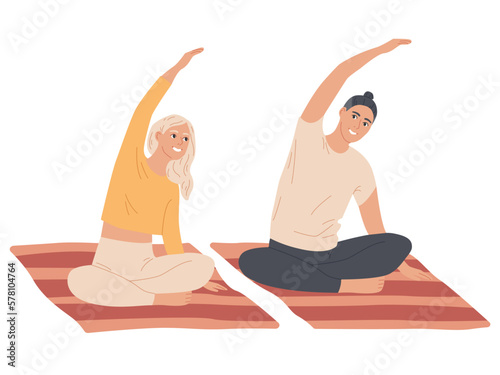 Couple of young people do exercises at home.