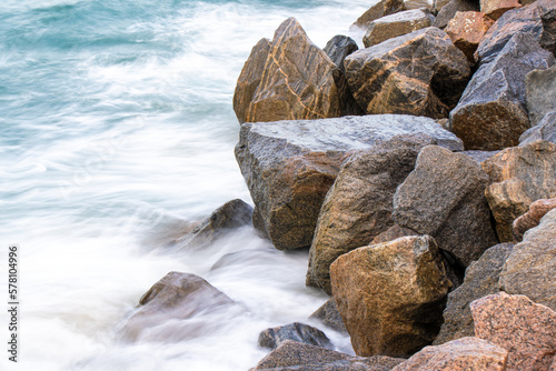 sea waves crashing on the rocks. long exposure photography