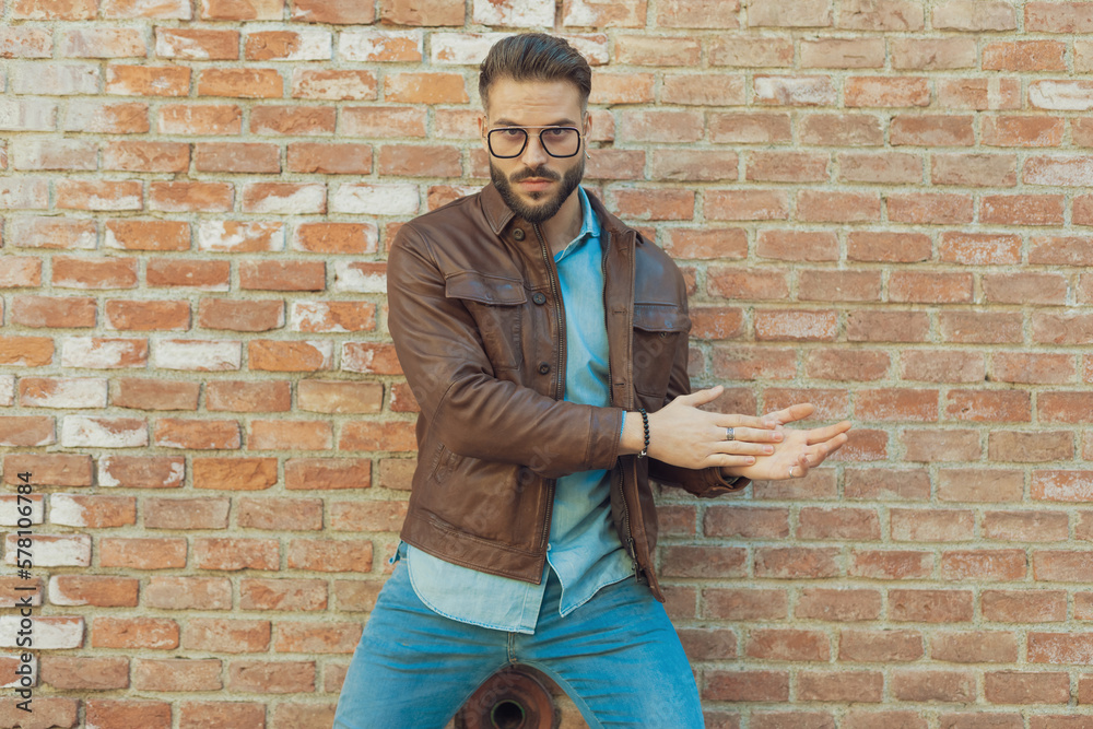 casual man rubbing his palms with tough vibe casual man rubbing his palms with tough vibe