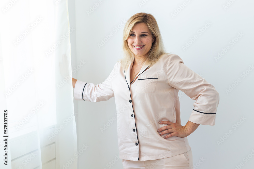Cute female model in pajama enjoying morning. Pleasant woman. Good mood Cute female model in pajama enjoying morning. Pleasant woman. Good mood