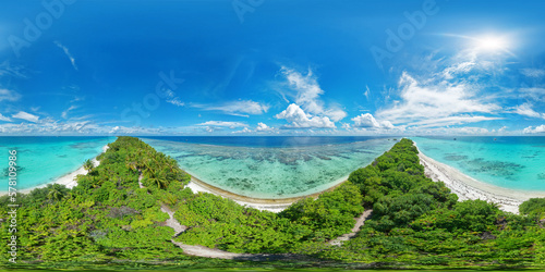 Fototapeta Naklejka Na Ścianę i Meble -  Panoramic view of one of the atolls in the Maldives from a bird's eye view. A thin strip of land of sand connecting the larger parts of the island. Aerial seamless 360 degree spherical panorama