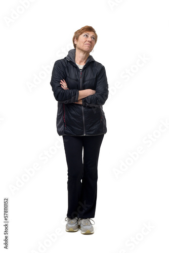 front view of a woman with sportswear lookimg up o white background photo