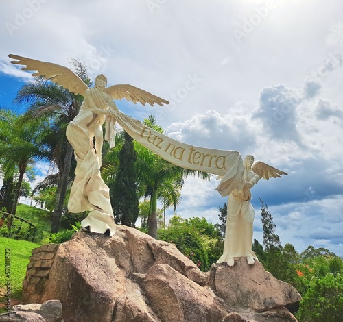 Aparecida  Sao Paulo  Brazil - November 30  2022. Two statues representing abjos with a banner with the words Paz na Terra from the crib in Aparecida.