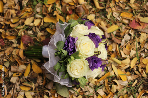 bouquet of flowers on autumn leaves, flowers on leaves photo
