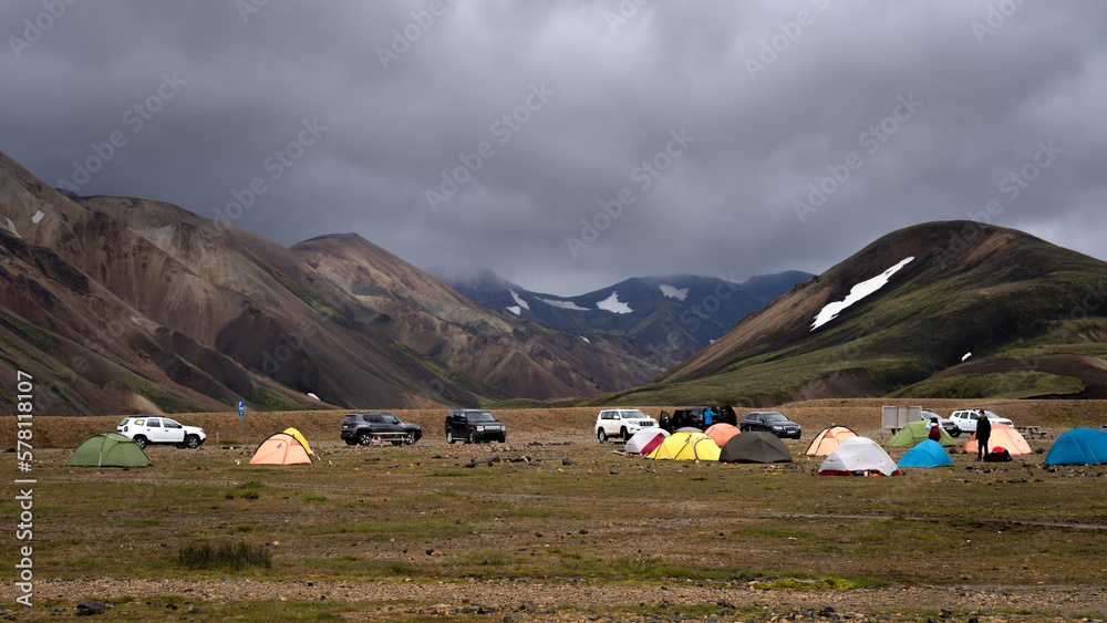 Scenic view of Landmannalaugar camping site surrounded by magnificent colourful mountains, Icelandind highlands