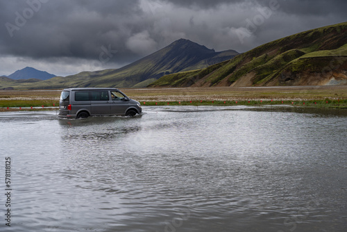 4WD car crossing a river near Landmannalaugar campsite in Icelandic highlands © hopsalka