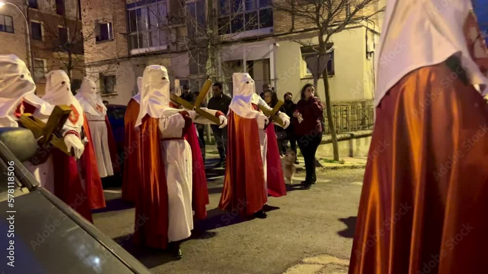 Soria, Spain - April 11, 2022: Video of Holy Week procession of hooded people down the street carrying the Christ on Holy Monday Soria, Spain - April 11, 2022: Video of Holy Week procession of hooded people down the street carrying the Christ on Holy Monday