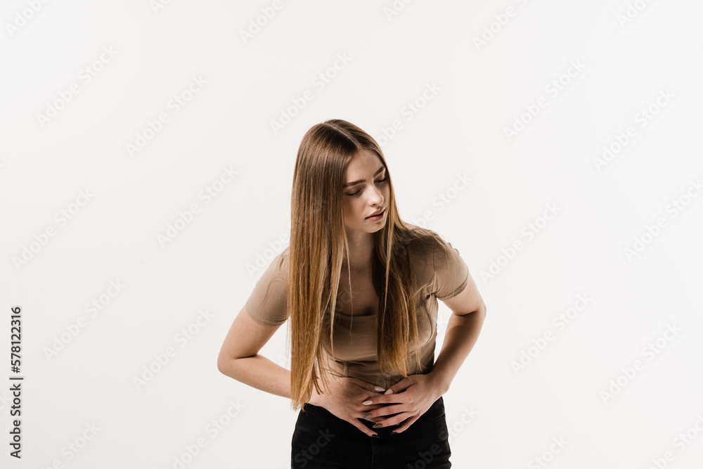 Ulcer or gastritis stomach ache. Sick girl hold abdomen because it hurts. Pancreatitis disease of pancreas becomes inflamed. Ulcer or gastritis stomach ache. Sick girl hold abdomen because it hurts. Pancreatitis disease of pancreas becomes inflamed.