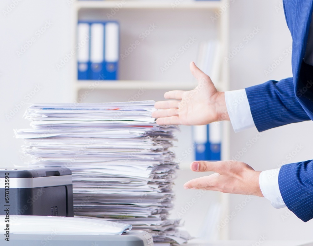 Businessman making copies in copying machine Businessman making copies in copying machine