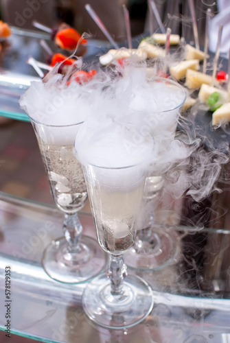 champagne and dry ice at the celebration of the wedding guests table buffet party