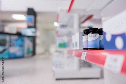 Fototapeta Naklejka Na Ścianę i Meble -  Empty health care shop filled with boxes of medicaments and vitamins to help customers with disease. Pharmacy shelves filled with packages of medication and drugs, pills and healthcare products.