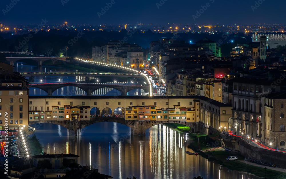Night view of Ponte Vecchio over Arno River in Florence, Italy. Architecture and landmark of Florence. Cityscape of Florence