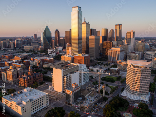 Skyline of Dallas, Texas, seen from the Reunion Tower with golden sun and the Dallas County Courthouse in the lower corner. photo