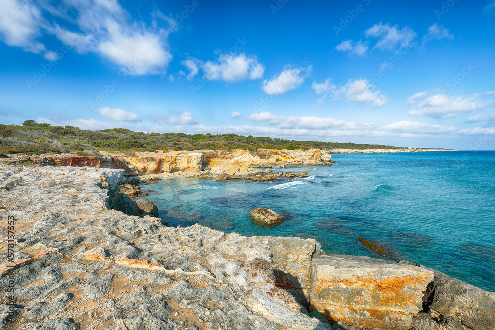 Picturesque seascape with white rocky cliffs, sea bay, islets and faraglioni near by beach Spiaggia della Punticeddha