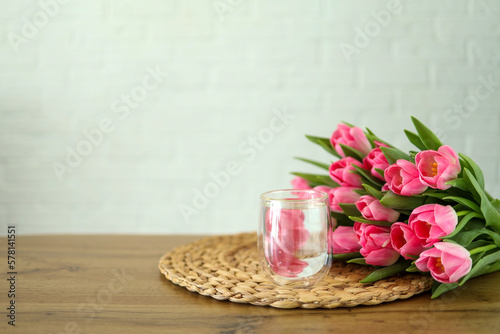 Glass of water and bunch of flowers, good morning concept