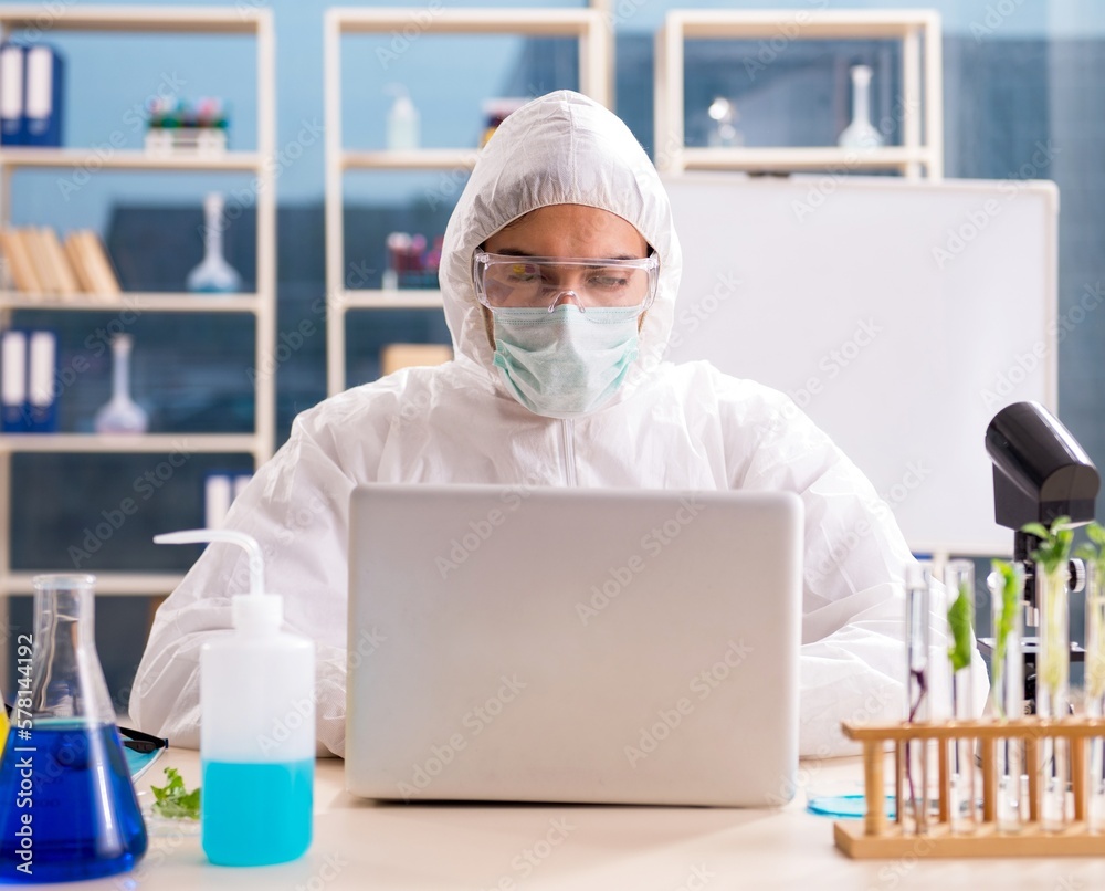 Male biotechnology scientist chemist working in the lab Male biotechnology scientist chemist working in the lab