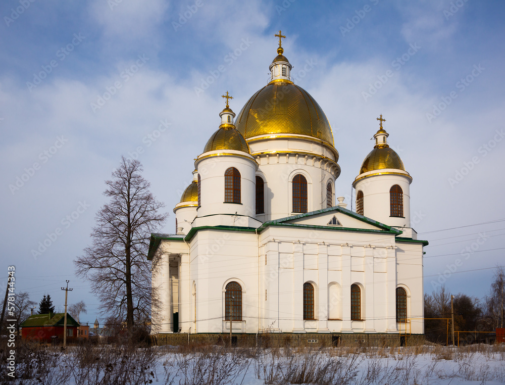Majestic building of Trinity Cathedral with golden domes in Russian town of Morshansk on winter day.
