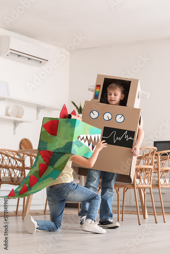 Little children in cardboar...