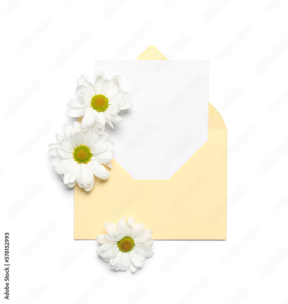 Envelope with blank card and chamomile flowers on light background Envelope with blank card and chamomile flowers on light background