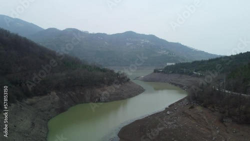 Drought in Turkey. Drought crisis in Türkiye. Aerial view of dam with low water level. Yuvacik dam or Kirazdere dam in Kocaeli Turkey. Drone view. photo