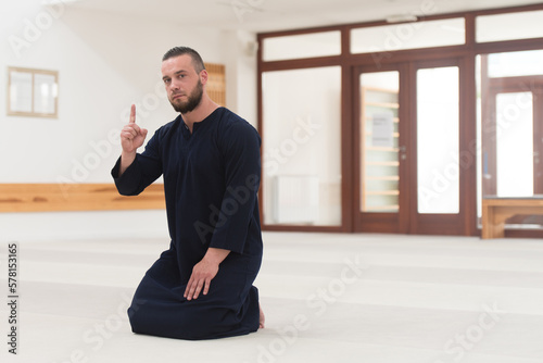 Muslim Man Praying Raising A Finger